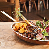 lamb shank for farmers type with beans and baked potatoes